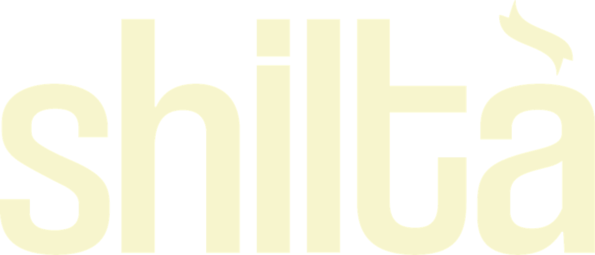 Shiltà wordmark in cream on brown
